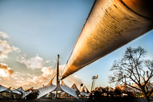 Free Dramatic view of Olympic Park architecture in Munich against a vibrant sunset sky. Stock Photo