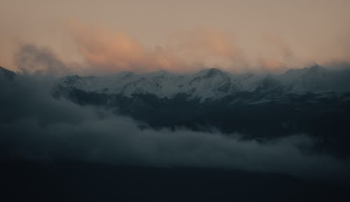 A Snow Covered Mountain at Dusk