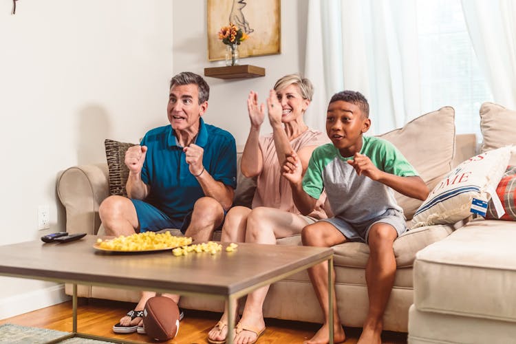 A Family Watching With Excitement