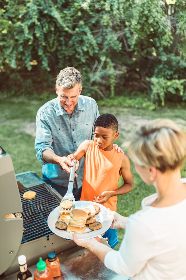 A Family Grilling Burgers