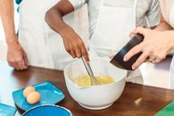 Person whisking Mixture in a Bowl