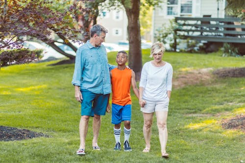 Man and Woman Walking with a Boy