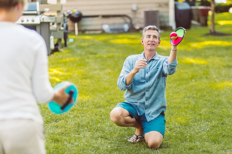 Man Playing Velcro Ball Game 