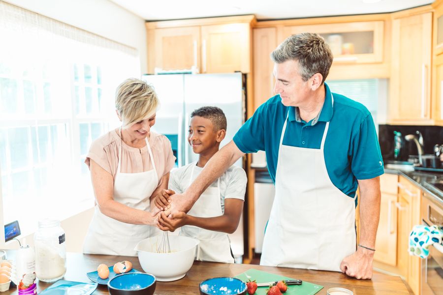 A family cooking together in a home kitchen