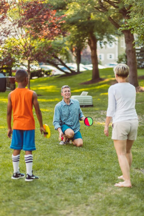 Free A Family Playing Outside Stock Photo