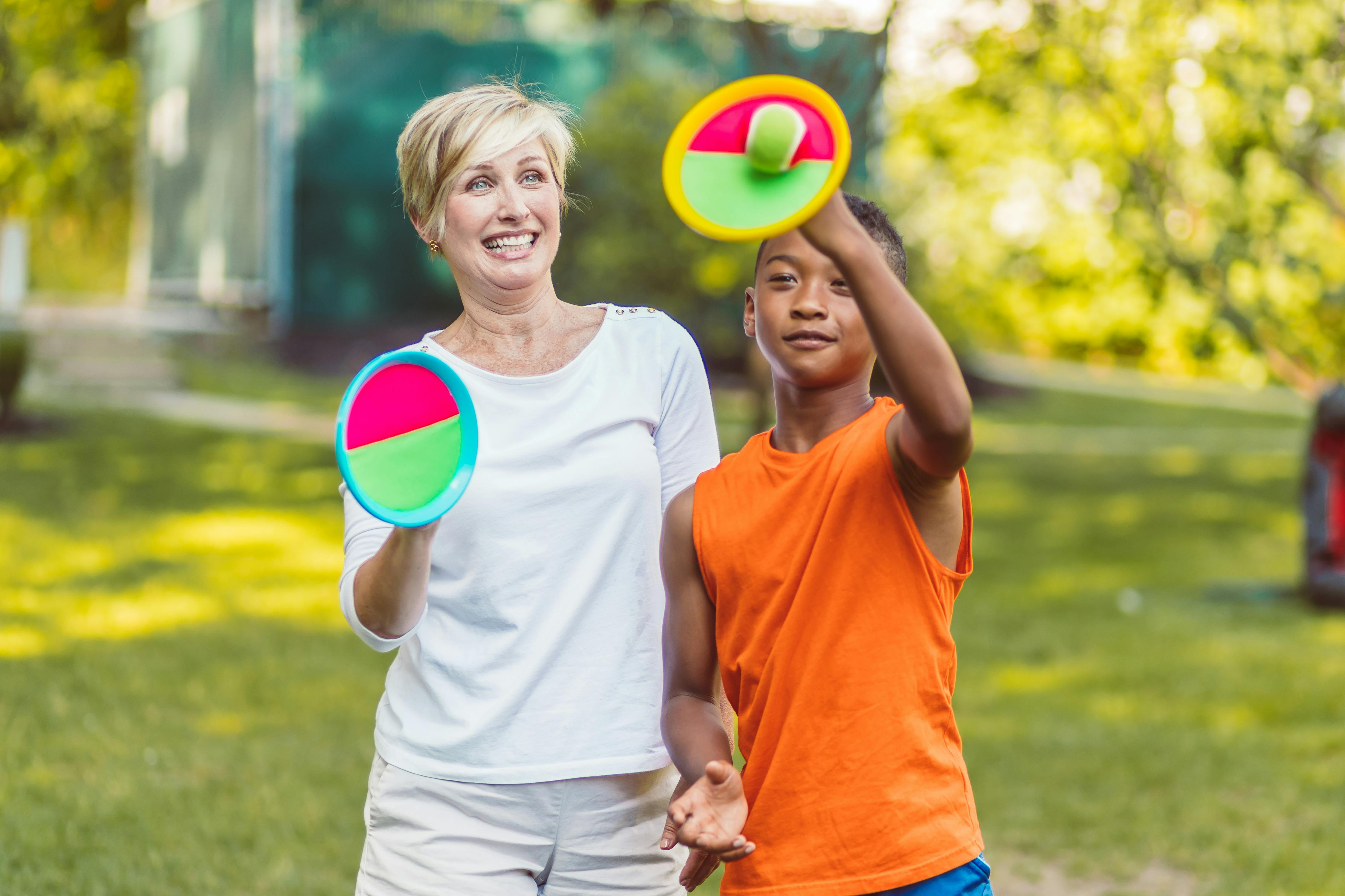 mother and son playing velcro ball game