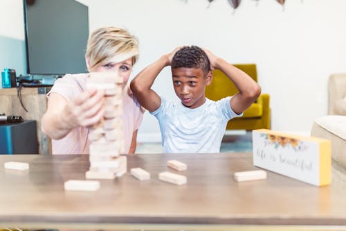 Mother and Son Playing Jenga Together