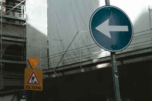 Blue and White Arrow Sign