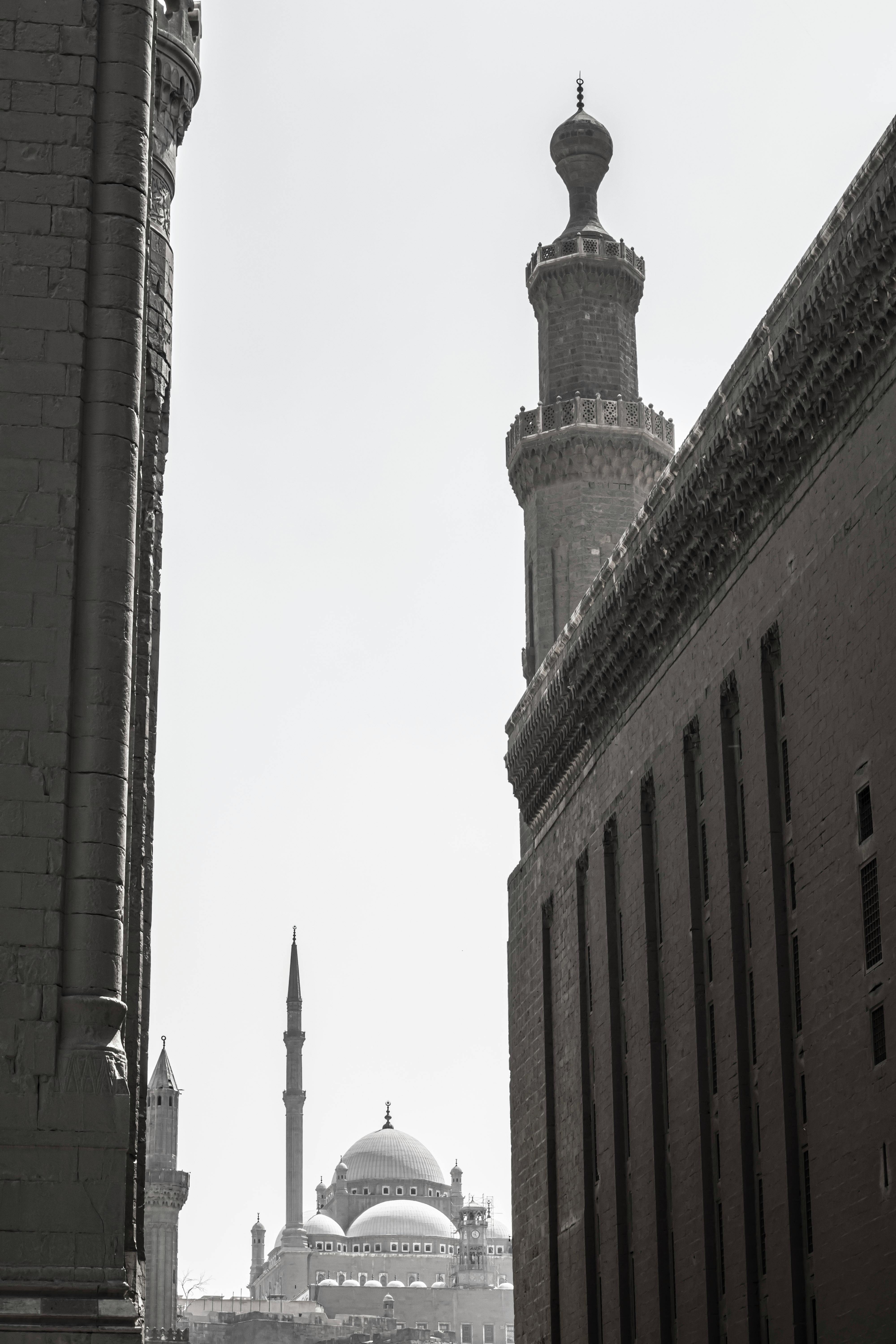 Black and white view of Cairo's historic mosques showcasing iconic minarets.