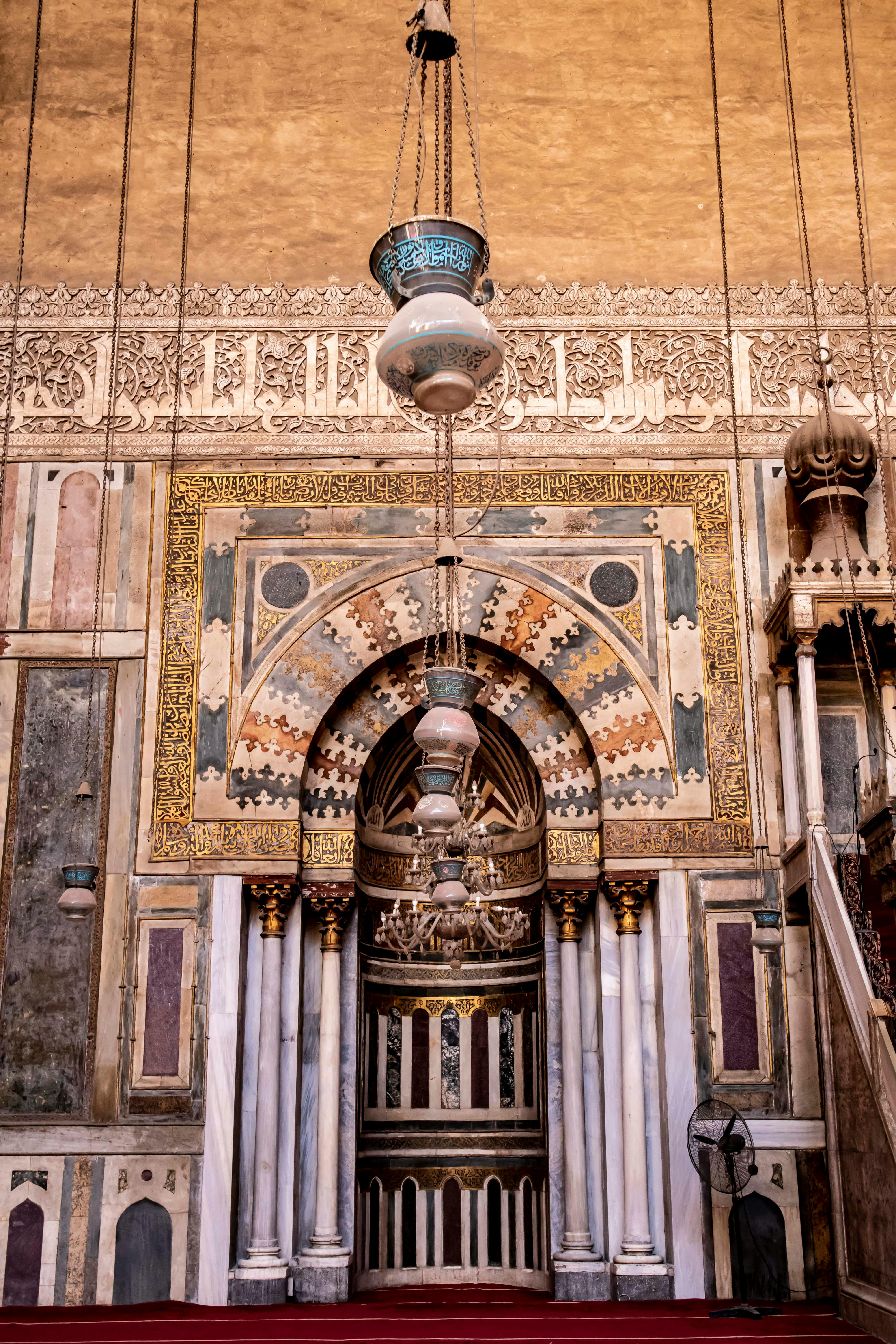 A stunning view of intricate Islamic architecture in a historic Cairo mosque, Egypt.