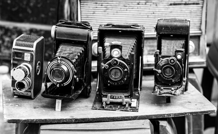 Vintage Cameras On Wooden Table