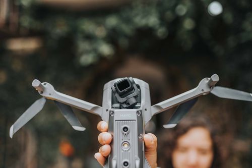 Free Close-up of a drone held by a person, ready for an outdoor flight. Stock Photo
