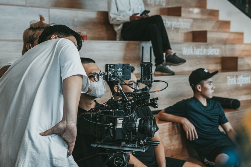 Crew members working together in a creative movie production environment.