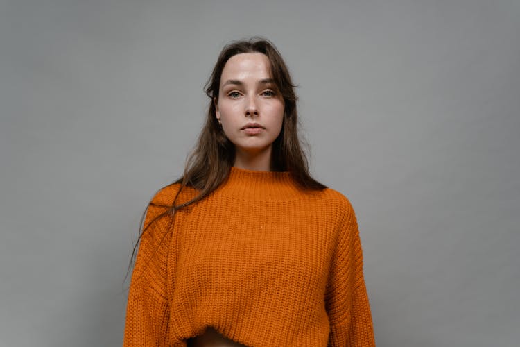 Woman In Orange Knit Turtleneck Sweater