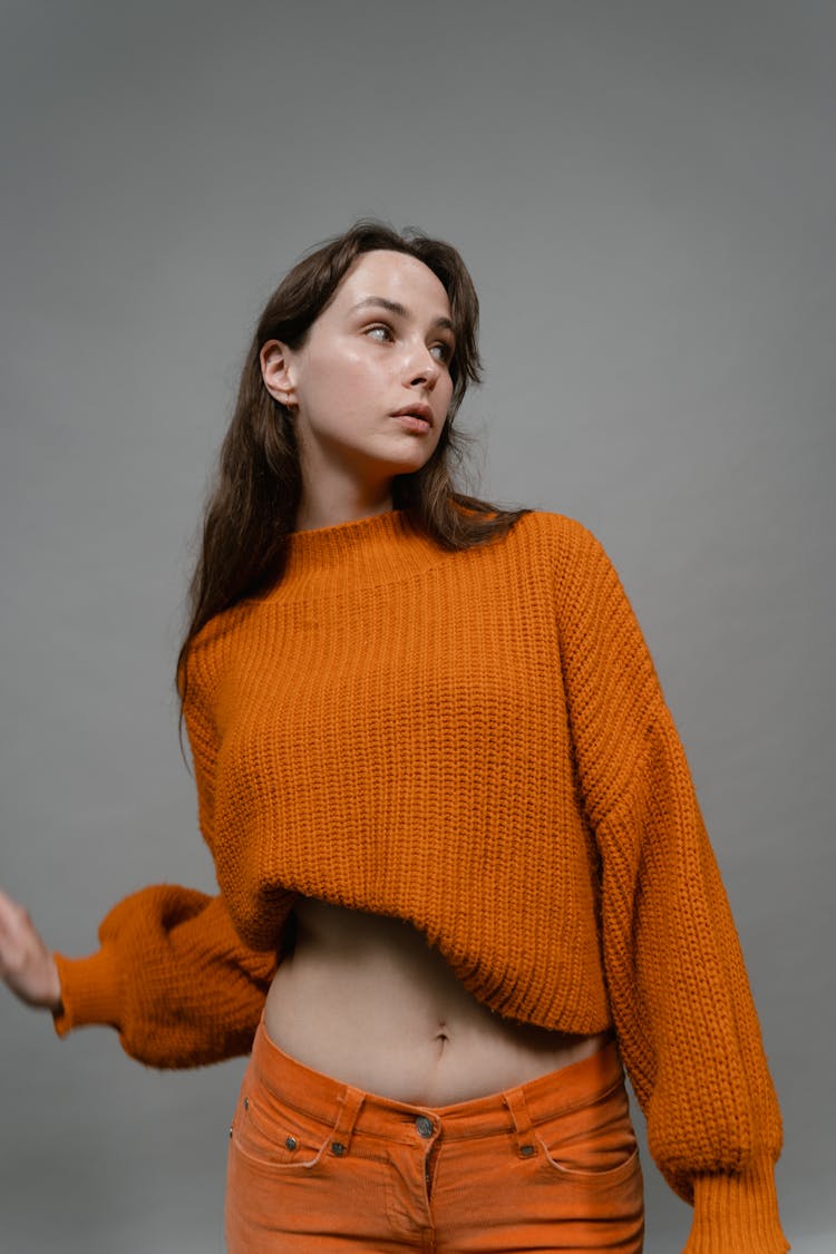 Stylish Woman In Orange Knit Sweater