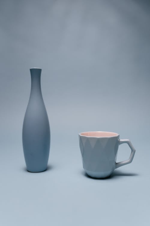 Blue Ceramic Vase near Ceramic Cup 