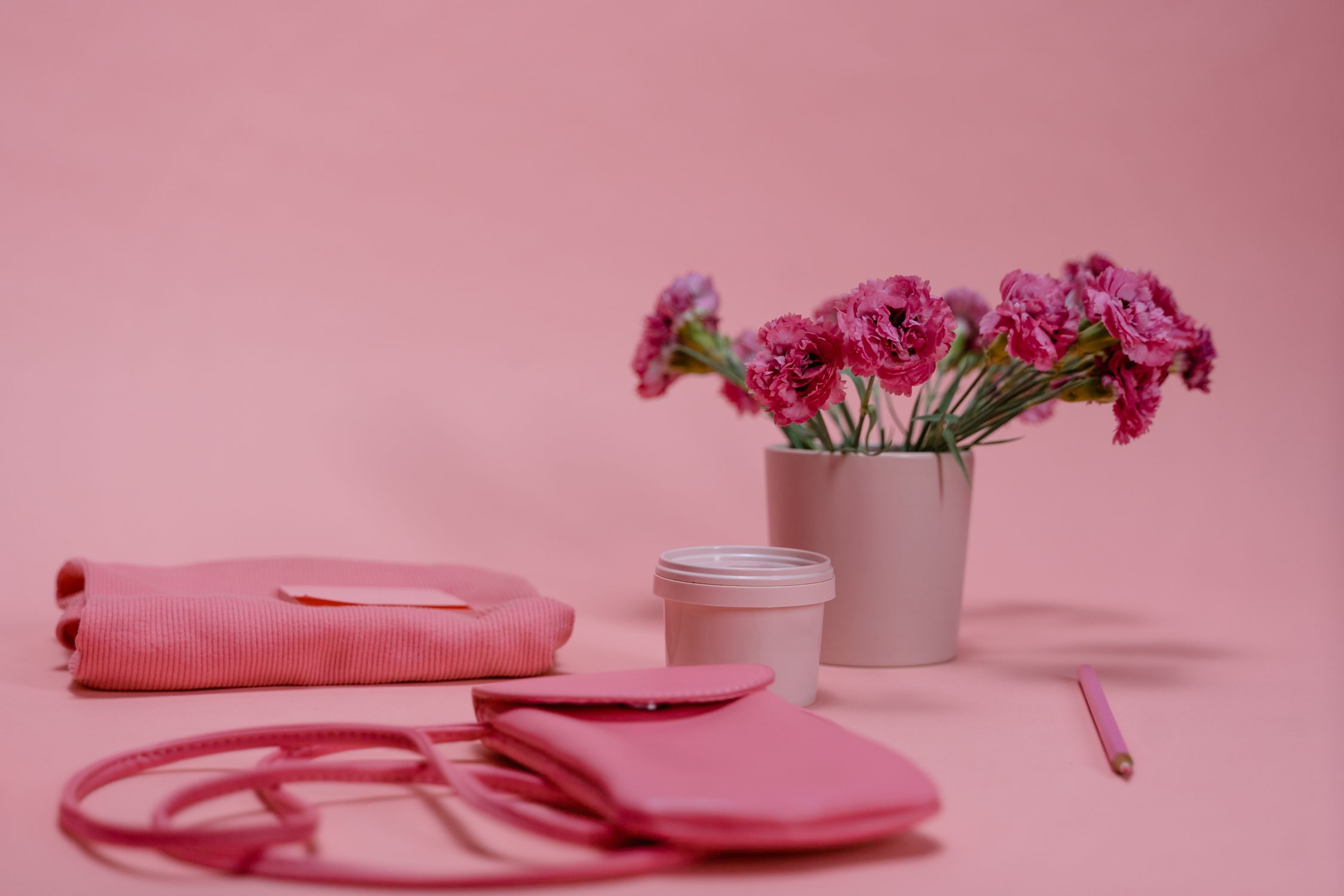 Assorted Pink Items on Pink Surface · Free Stock Photo