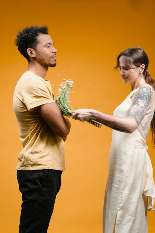 Free Man in Yellow Crew Neck T-shirt and Woman in White Dress Stock Photo