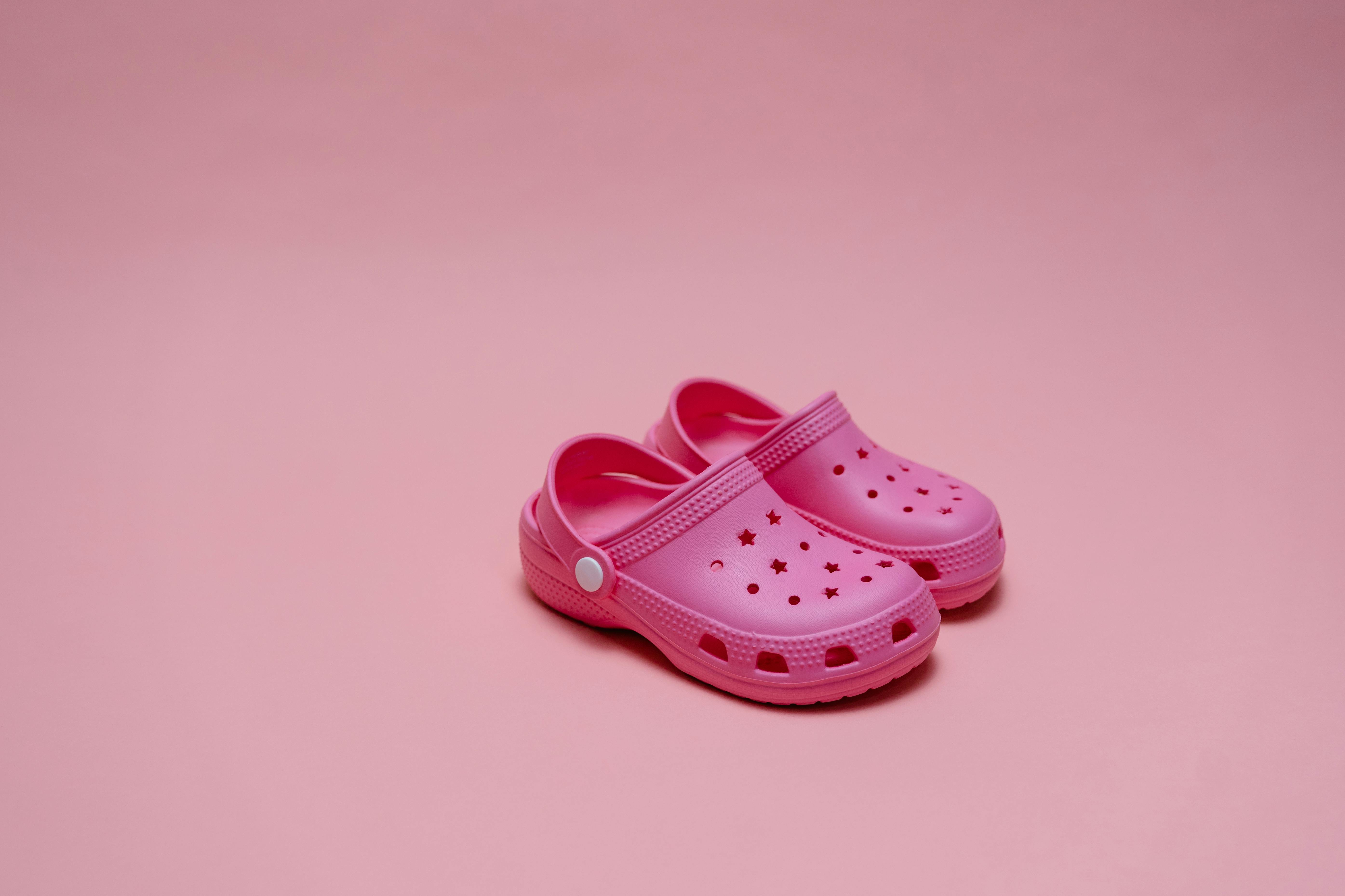 Pink Rubber Clogs on Pink Background · Free Stock Photo