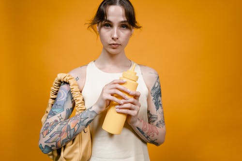 Free Woman holding a Squeeze Bottle  Stock Photo