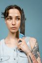 Woman in White Scoop Neck Shirt Holding Black and Silver Knife