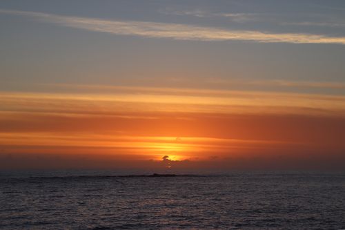 Free Stunning sunrise with vibrant hues over Coogee Beach, NSW. Perfect for tranquil and serene themes. Stock Photo