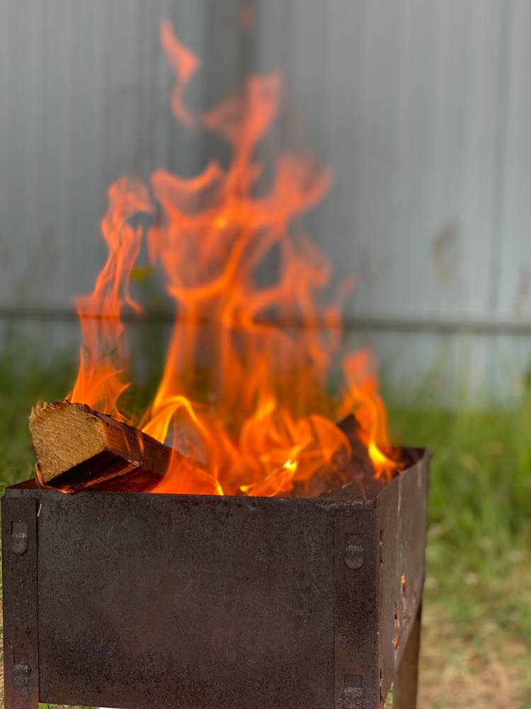 Close-up Of Wood Burning In Brazier