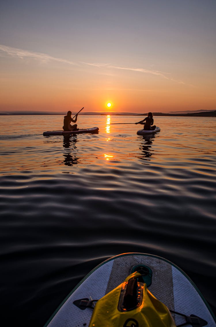 People On Kayak During Sunset