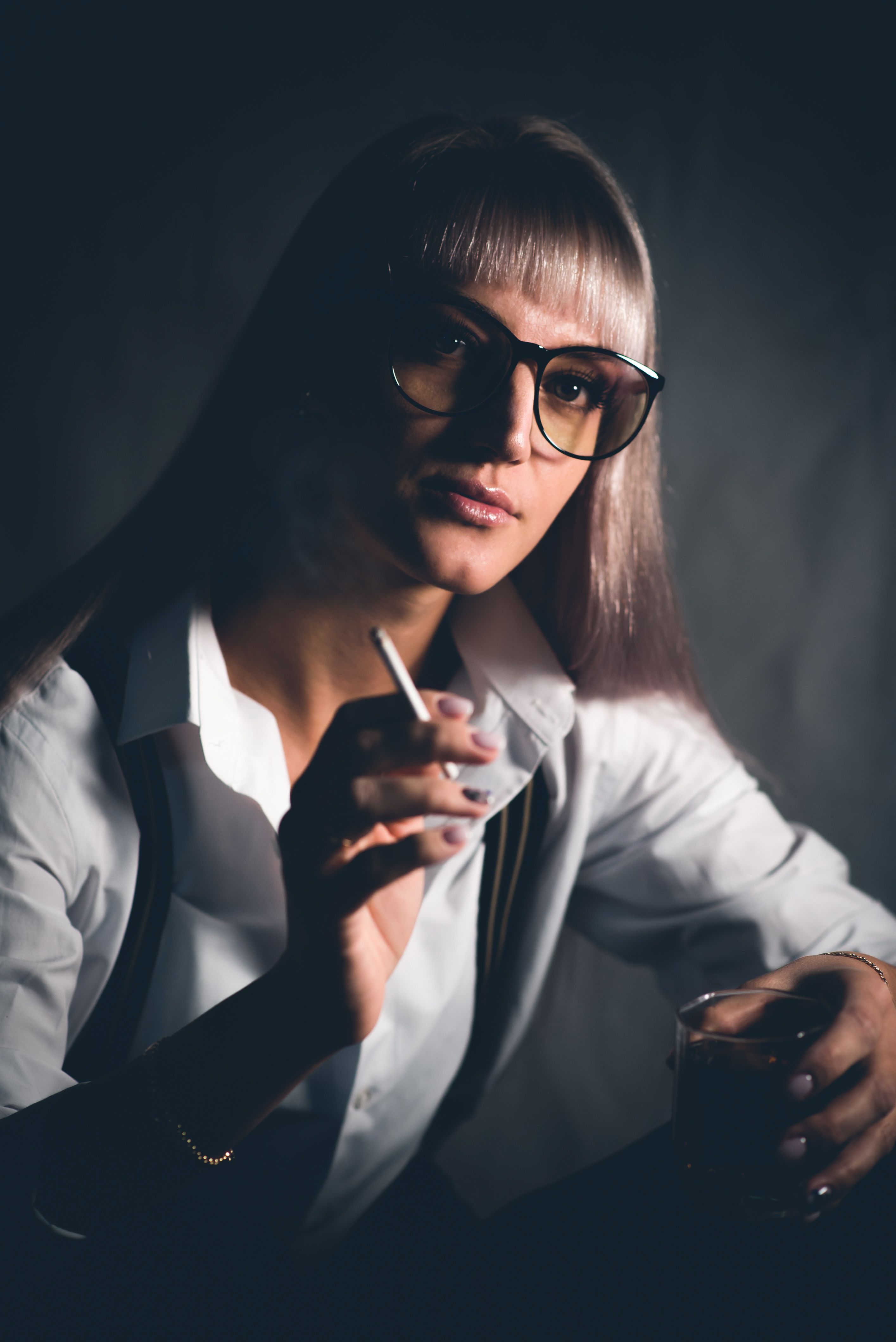 Elegant Blond Woman in Eyeglasses Smoking Cigarette · Free Stock Photo
