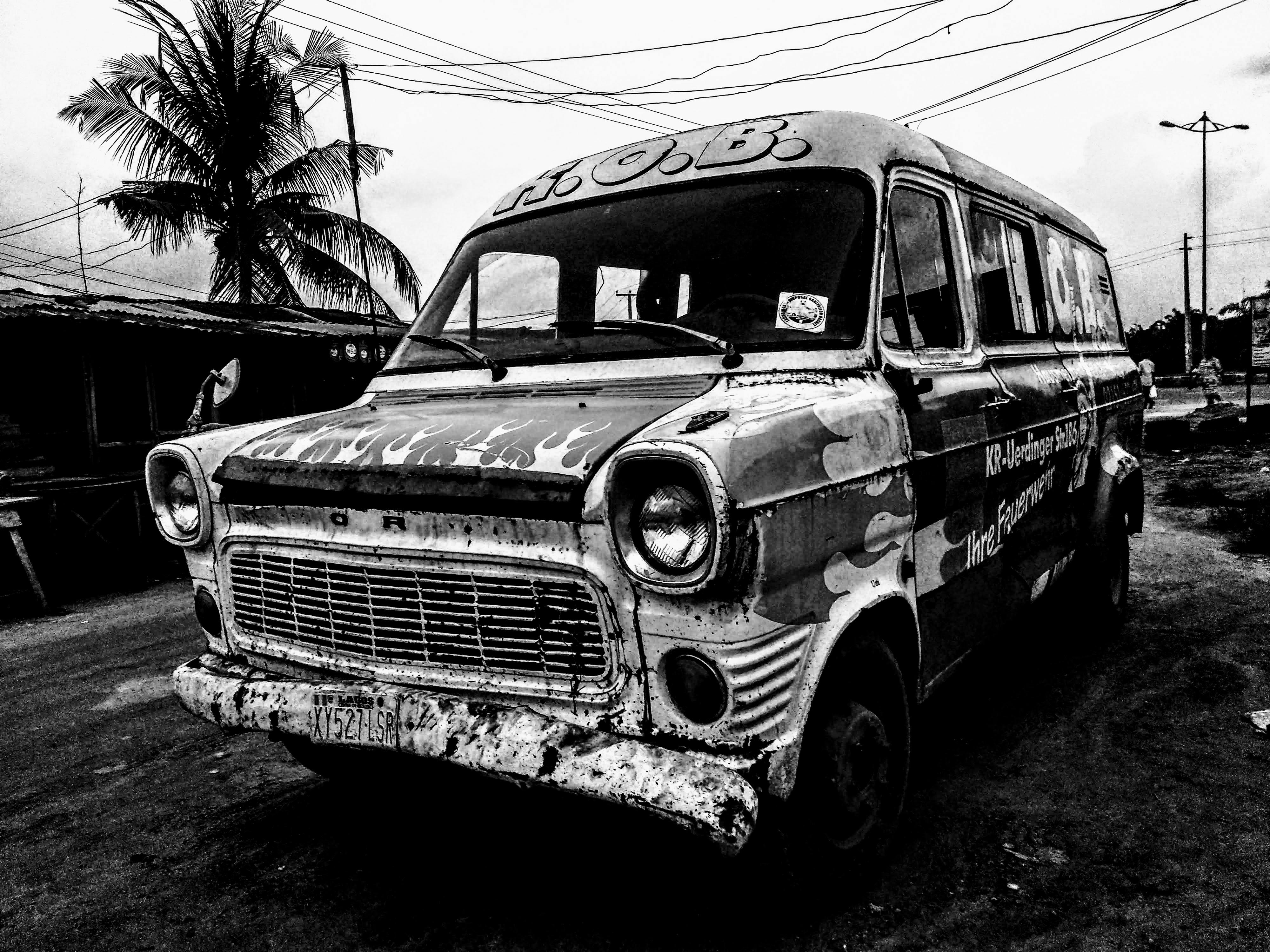 abandoned van in grayscale photography