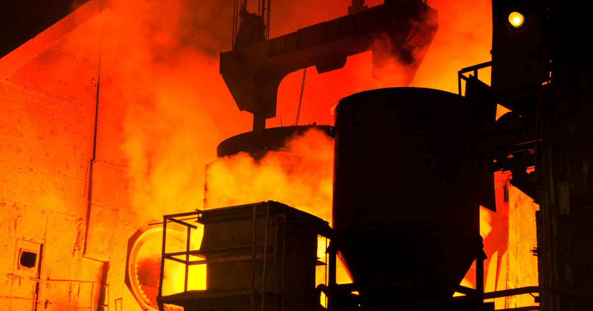 Molten metal being cast inside an active steel mill.