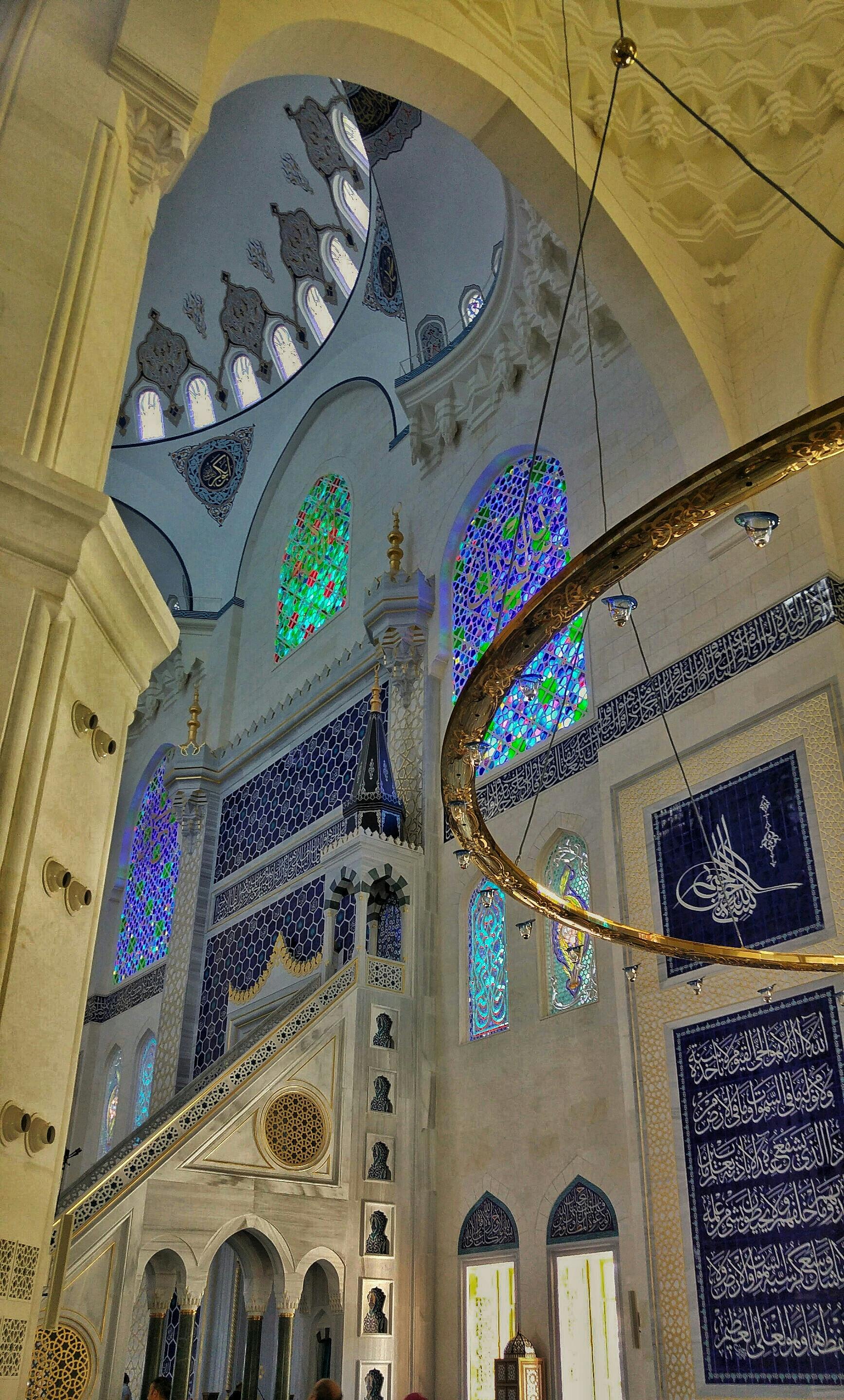 Iced coffee drink being prepared with milk or protein poured over ice