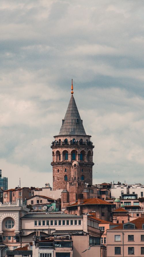 Free Vertical view of the historic Galata Tower, a landmark amidst Istanbul's urban landscape. Stock Photo