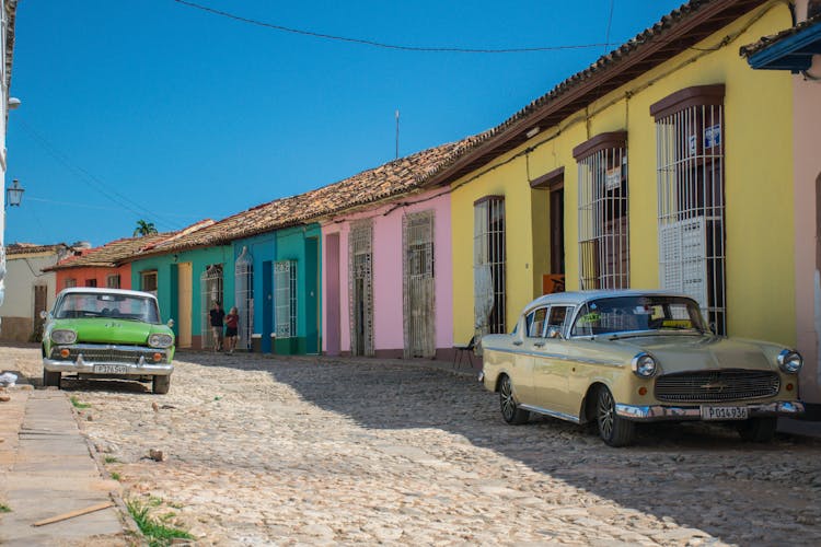 Classic Cars In A Colorful Cuban Street