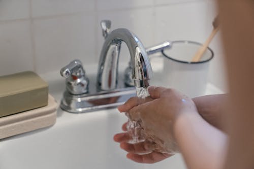 A Person Washing Hands