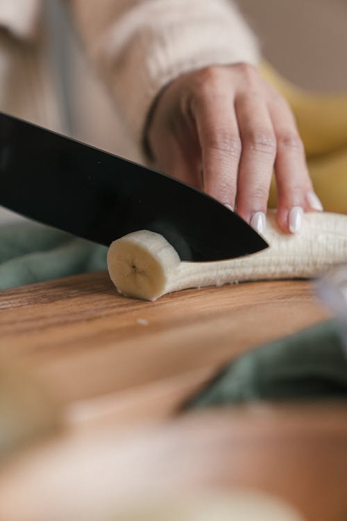 Slicing a Banana with a kitchen knife