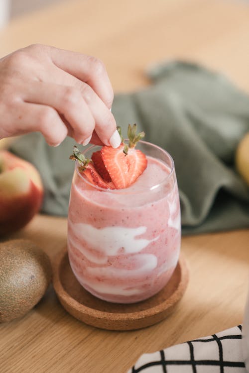 Close-Up Photo of a Smoothie with Strawberries on Top