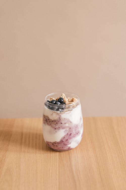 A Glass of Yogurt with Blueberries and Granolas 