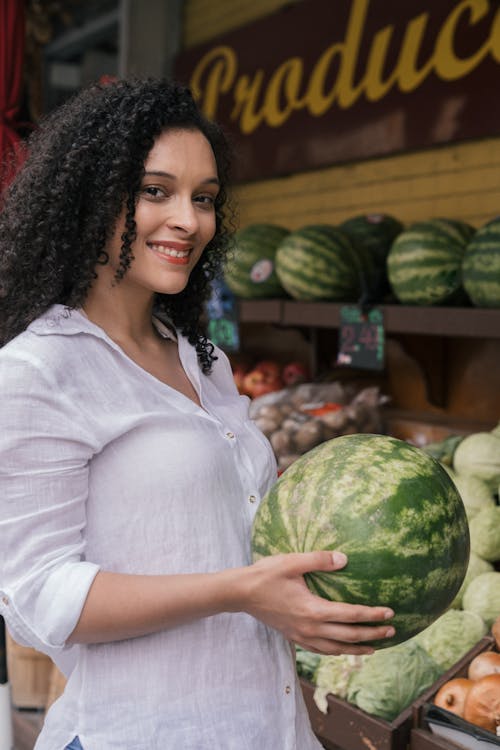 Smiling Woman Holding a Watermelon