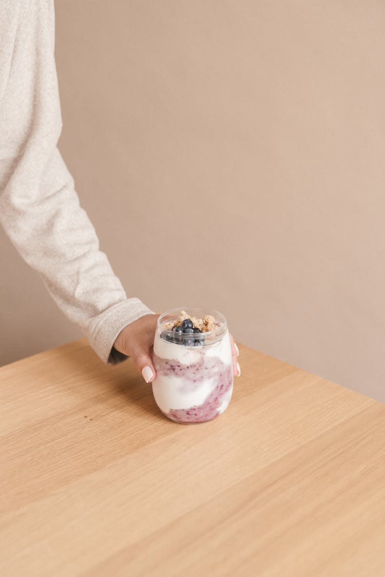 A Person Holding A Delicious Blueberry Smoothie