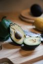 Sliced Avocado Fruit on Brown Wooden Chopping Board