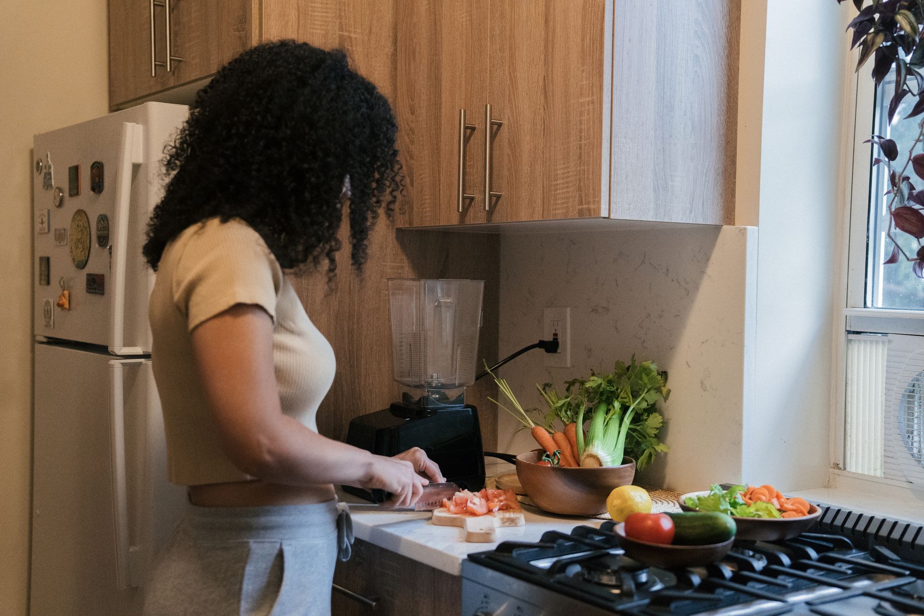 Setting up a roommate-friendly fridge labeling system to cut food waste while prepping dinner.