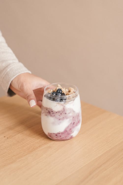 A Person Holding a Glass of Smoothie