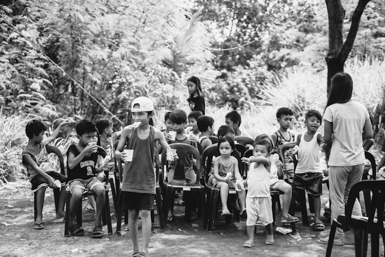 Monochrome Photo Of Kids Having Snacks