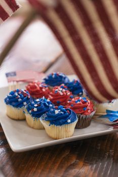 Delicious cupcakes with red, white, and blue frosting perfect for Fourth of July celebrations.