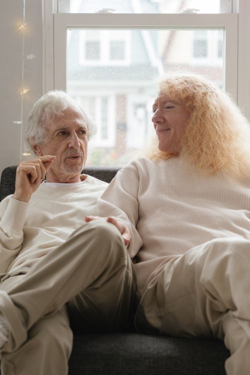 Free Elderly couple enjoying a moment together on a cozy couch indoors. Stock Photo