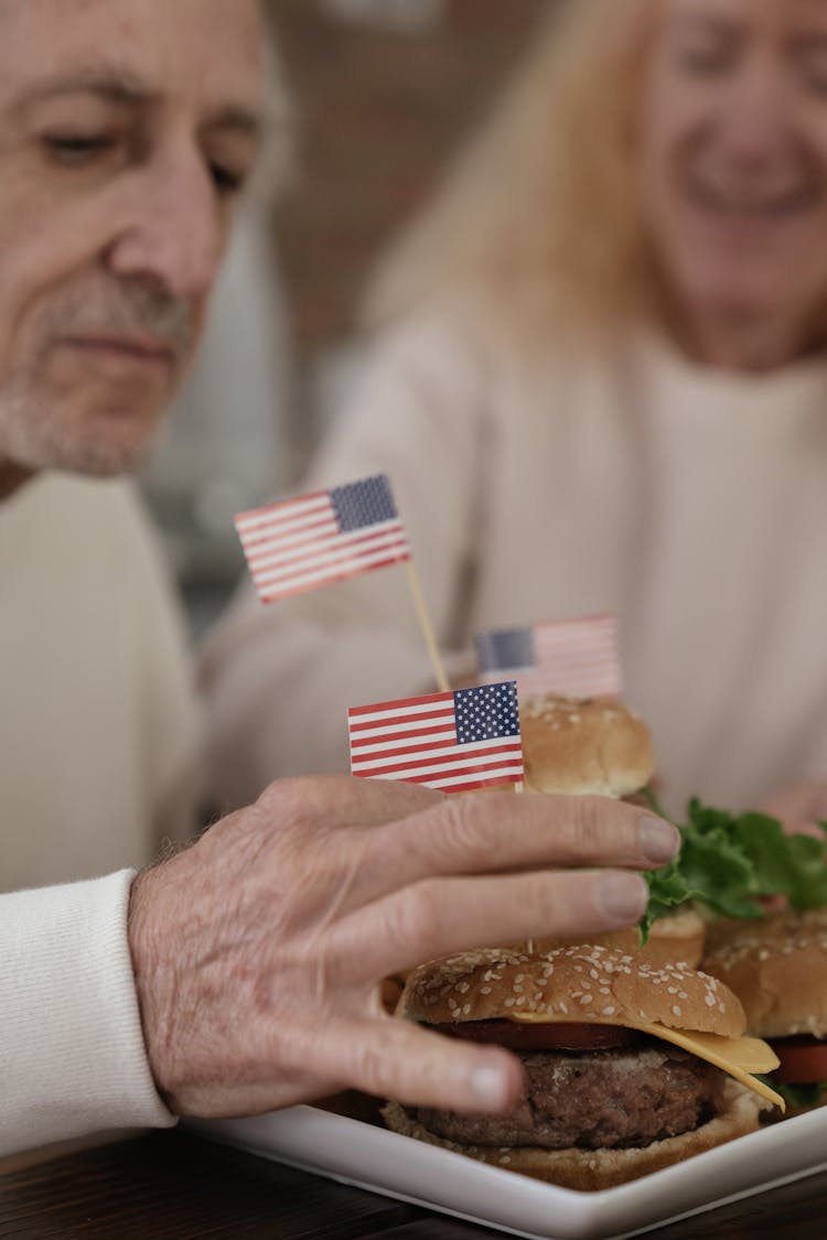 People Making Hamburgers With American Flags