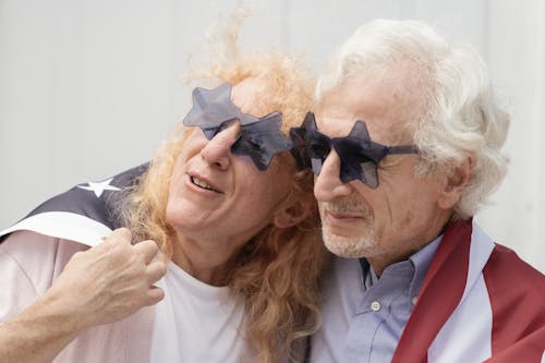 Free Elderly Couple wearing Star-shaped Sunglasses Stock Photo