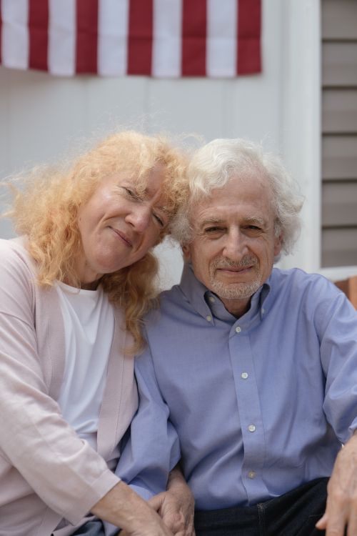 Free Smiling senior couple enjoying a sunny day, symbolizing love and togetherness. Stock Photo
