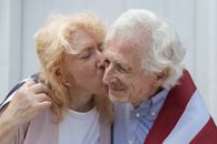 Man in White Crew Neck Shirt Beside Woman in White Crew Neck Shirt